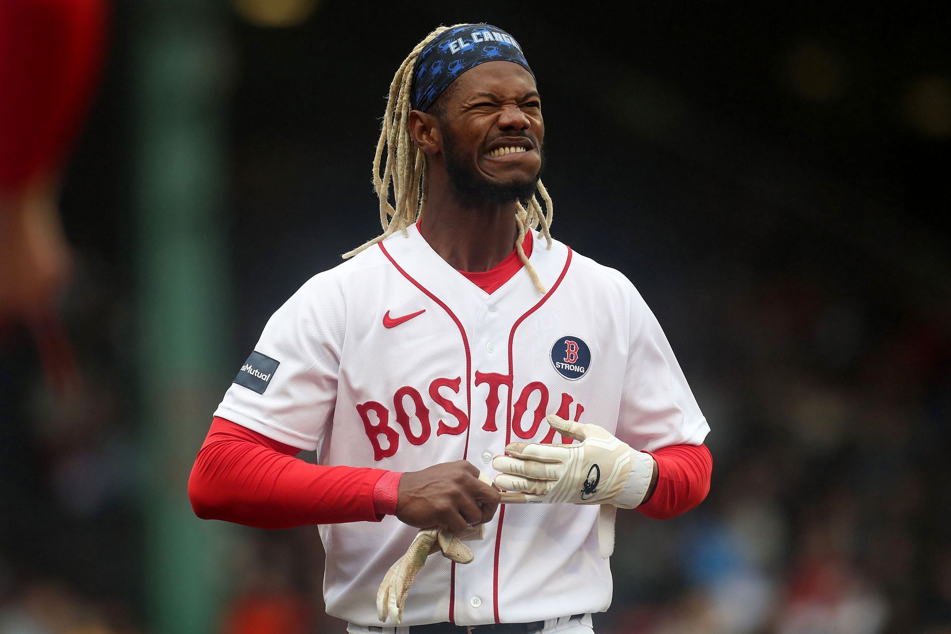 Red Sox fans go shirtless during lengthy rain delay at Fenway