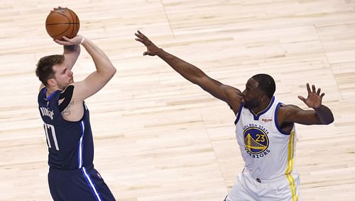 Luka Doncic (left) and Draymond Green