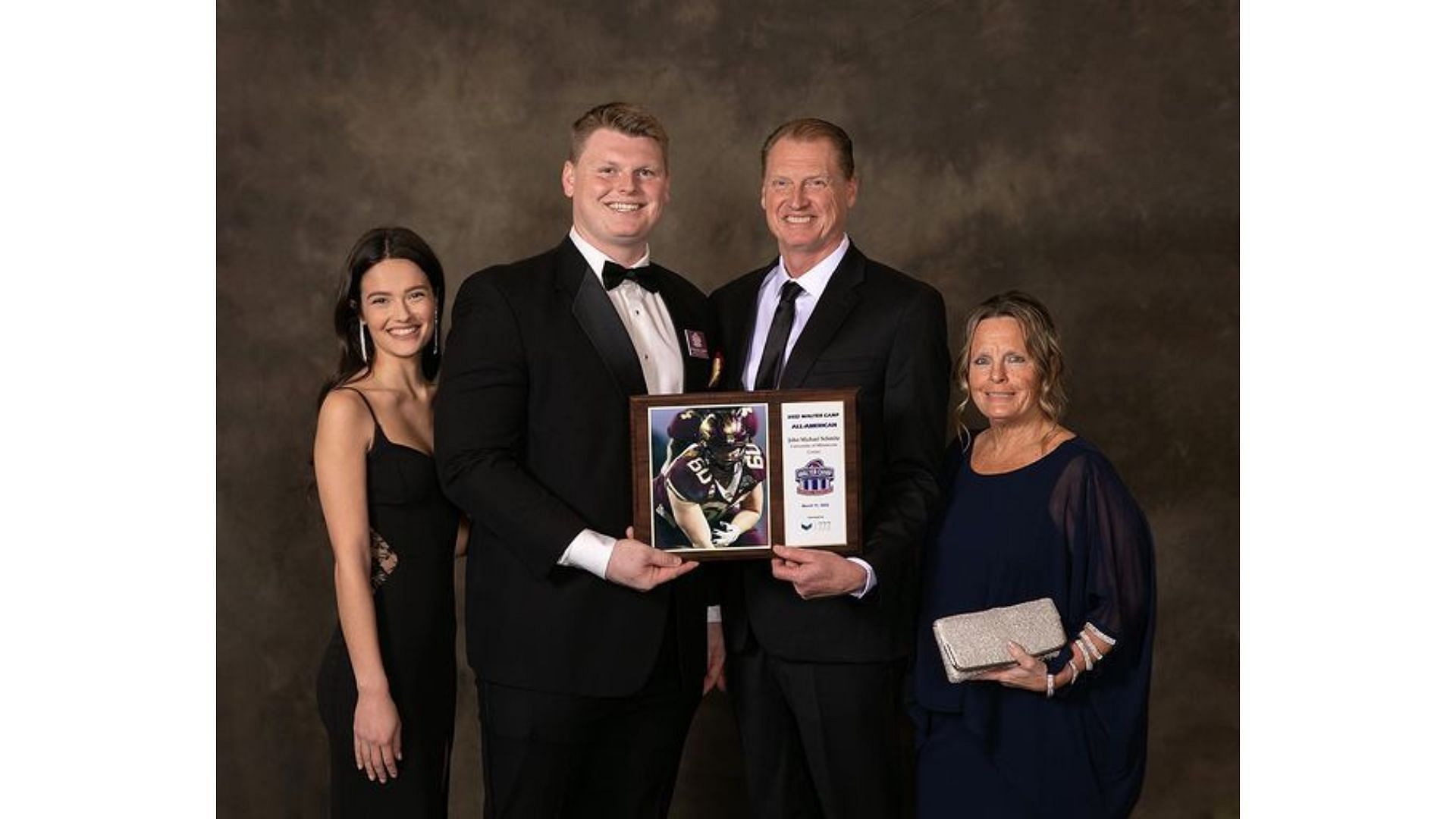 Daniella with Schmitz and his family, celebrating his First-team All-American honor