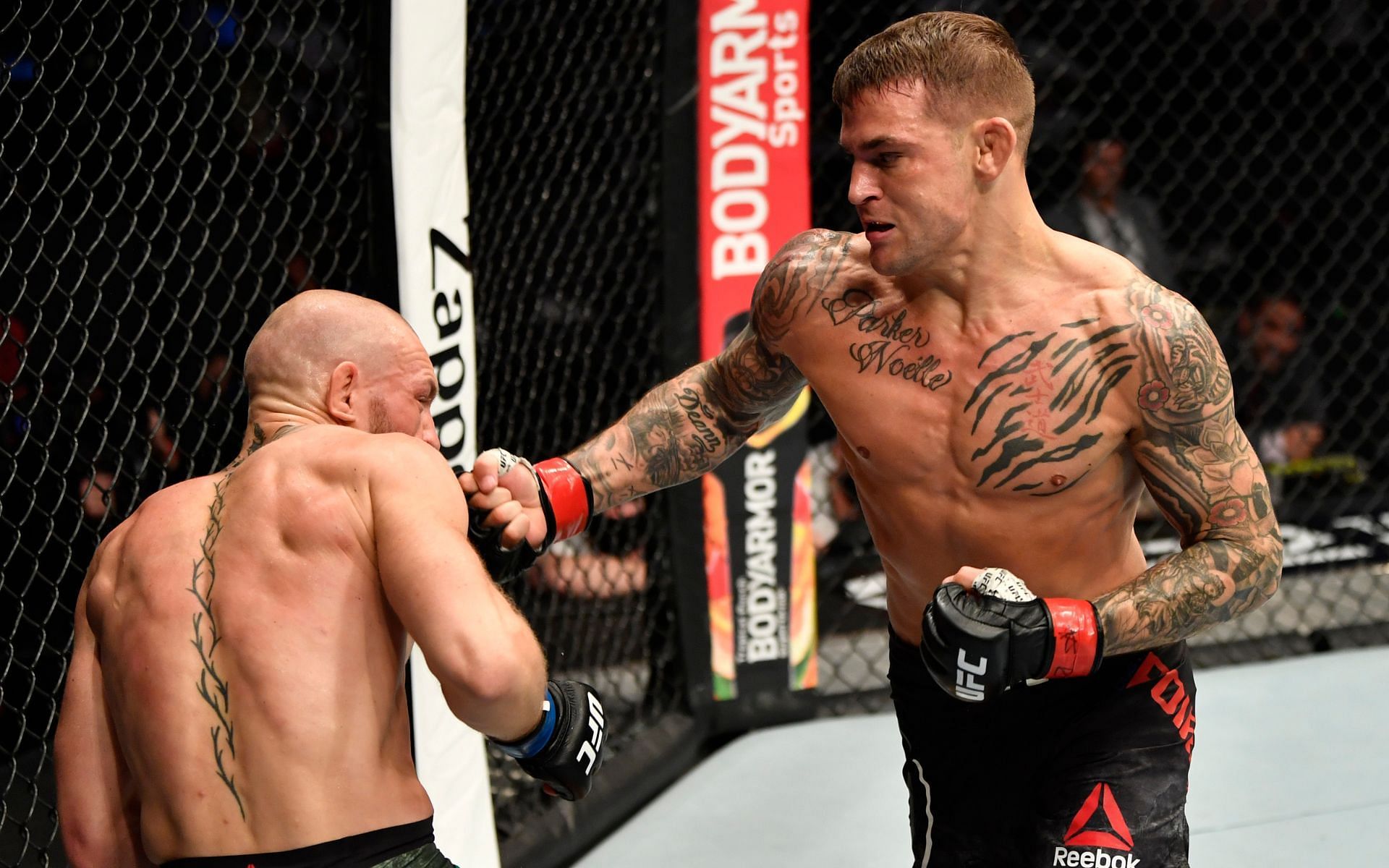 Conor McGregor (Left) getting out-struck by Dustin Poirier (Right) in their rematch