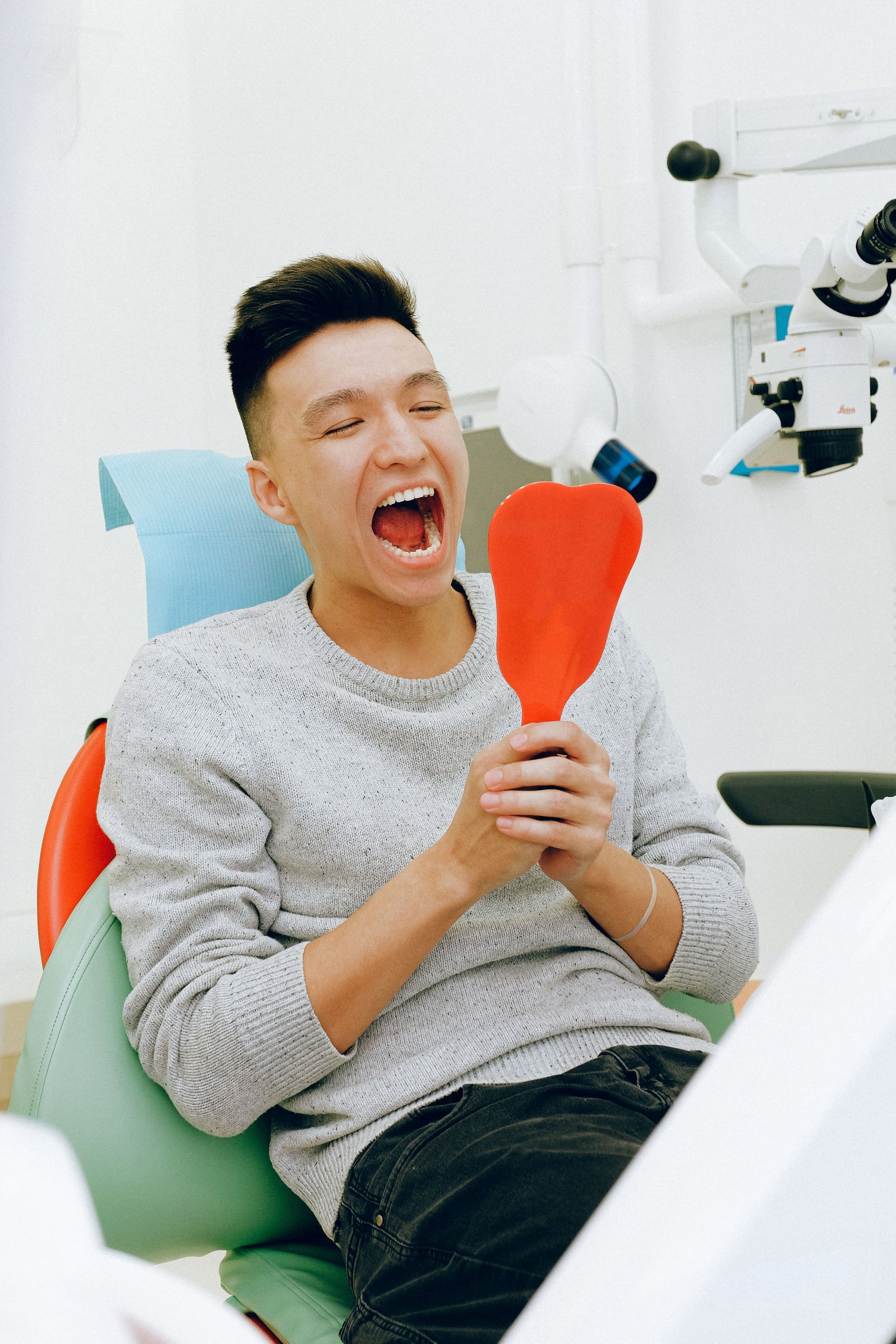 Treating oral health problems early can save you from more expensive and extensive procedures in the future (Image via Pexels)