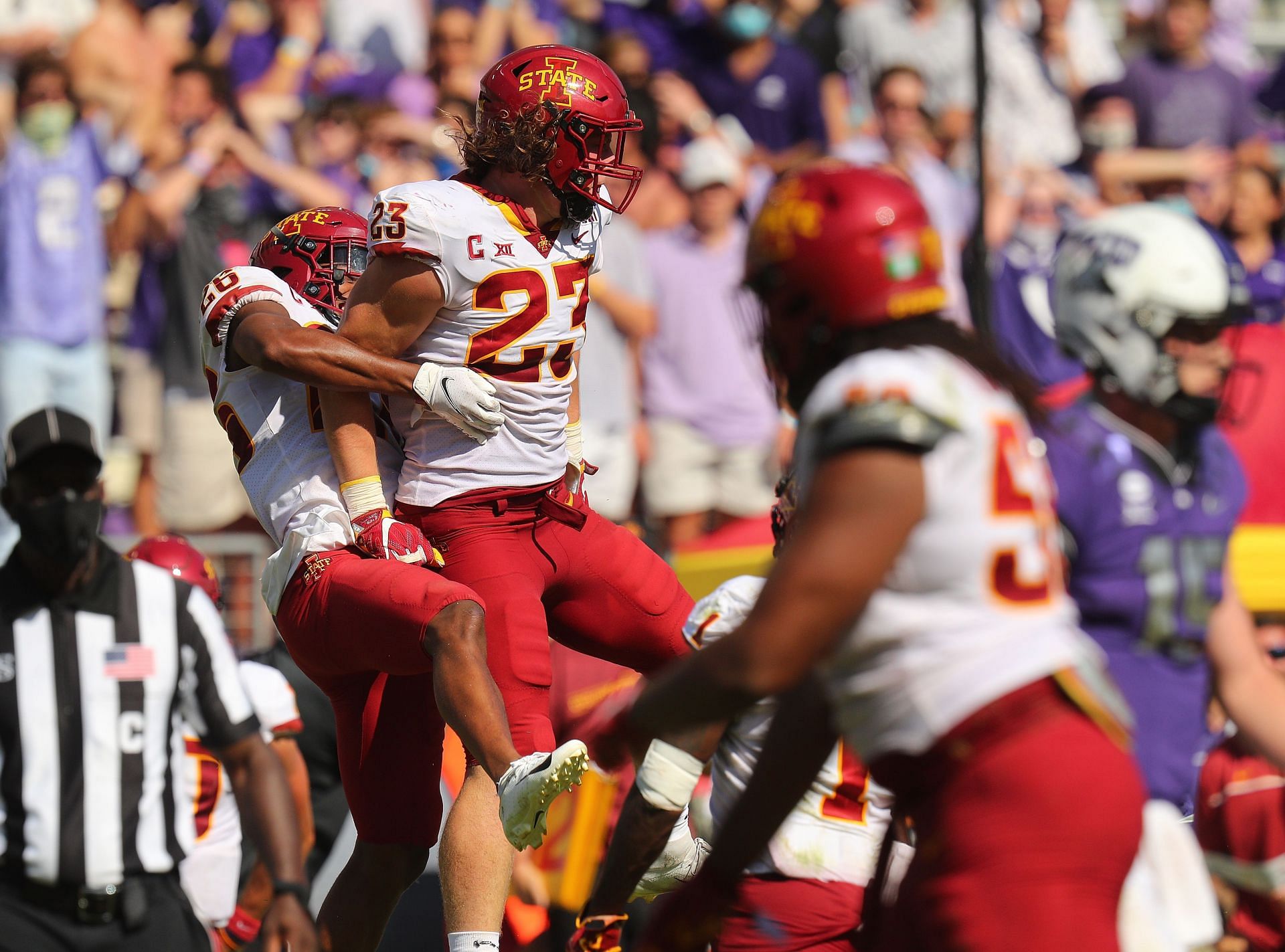 Anthony Johnson Jr. #26 and Mike Rose #23 of the Iowa State Cyclones celebrate a fourth quarter interception against the TCU Horned Frogs
