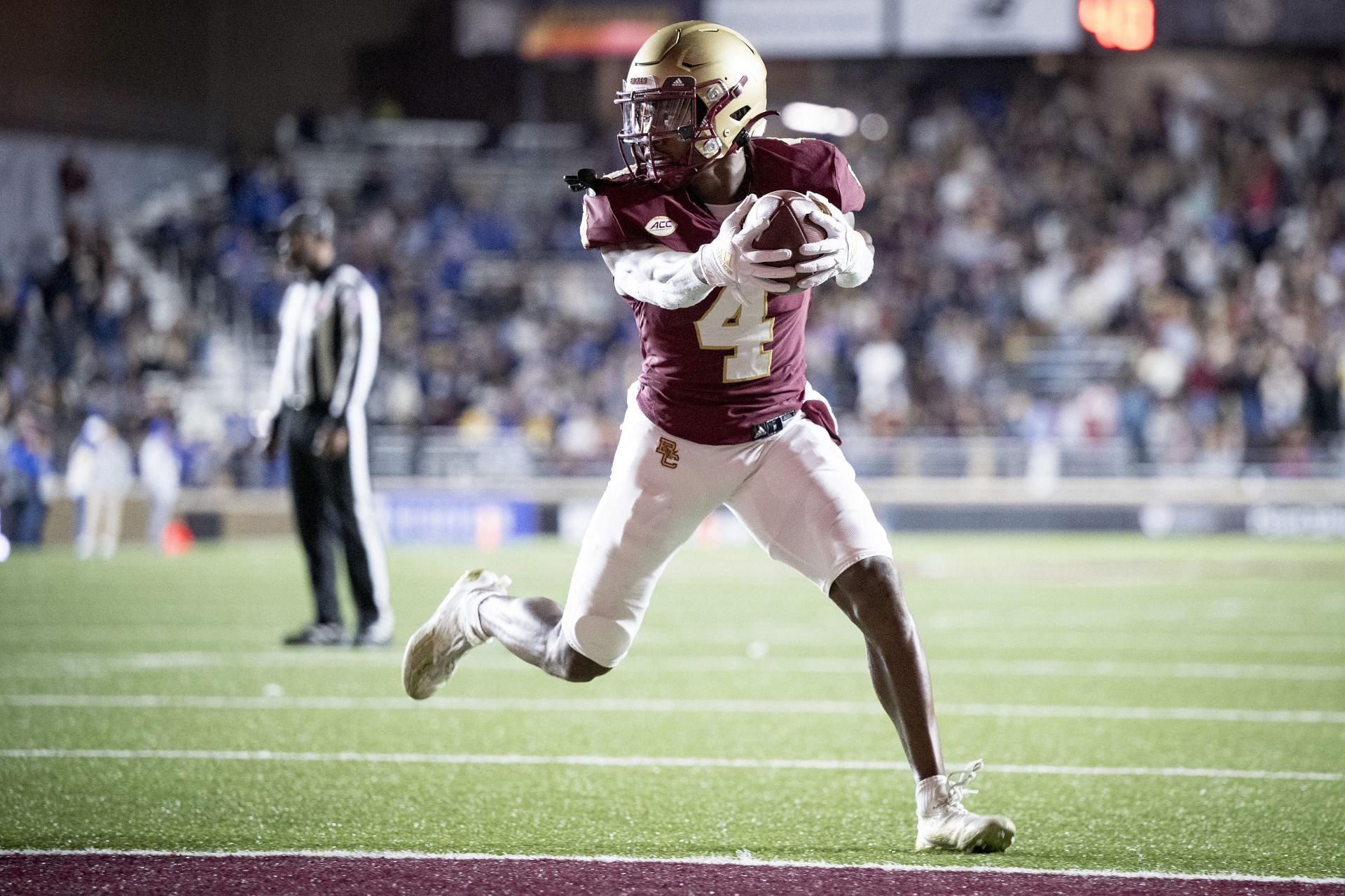 Zay Flowers #4 of the Boston College Eagles scores a touchdown during the first half of a game against the Duke Blue Devils