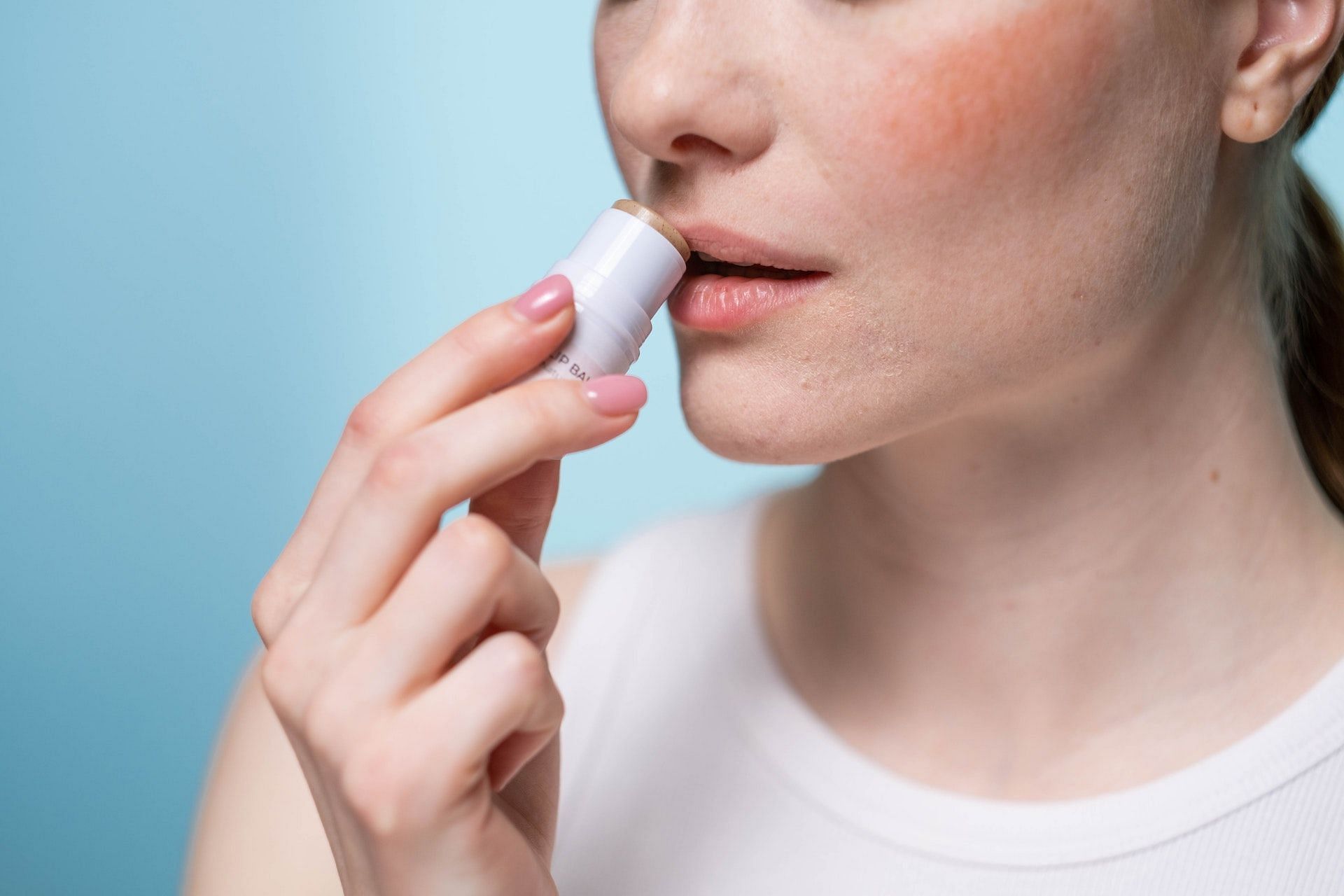 Avoid menthol-based lip balms. (Photo via Pexels/MART PRODUCTION)