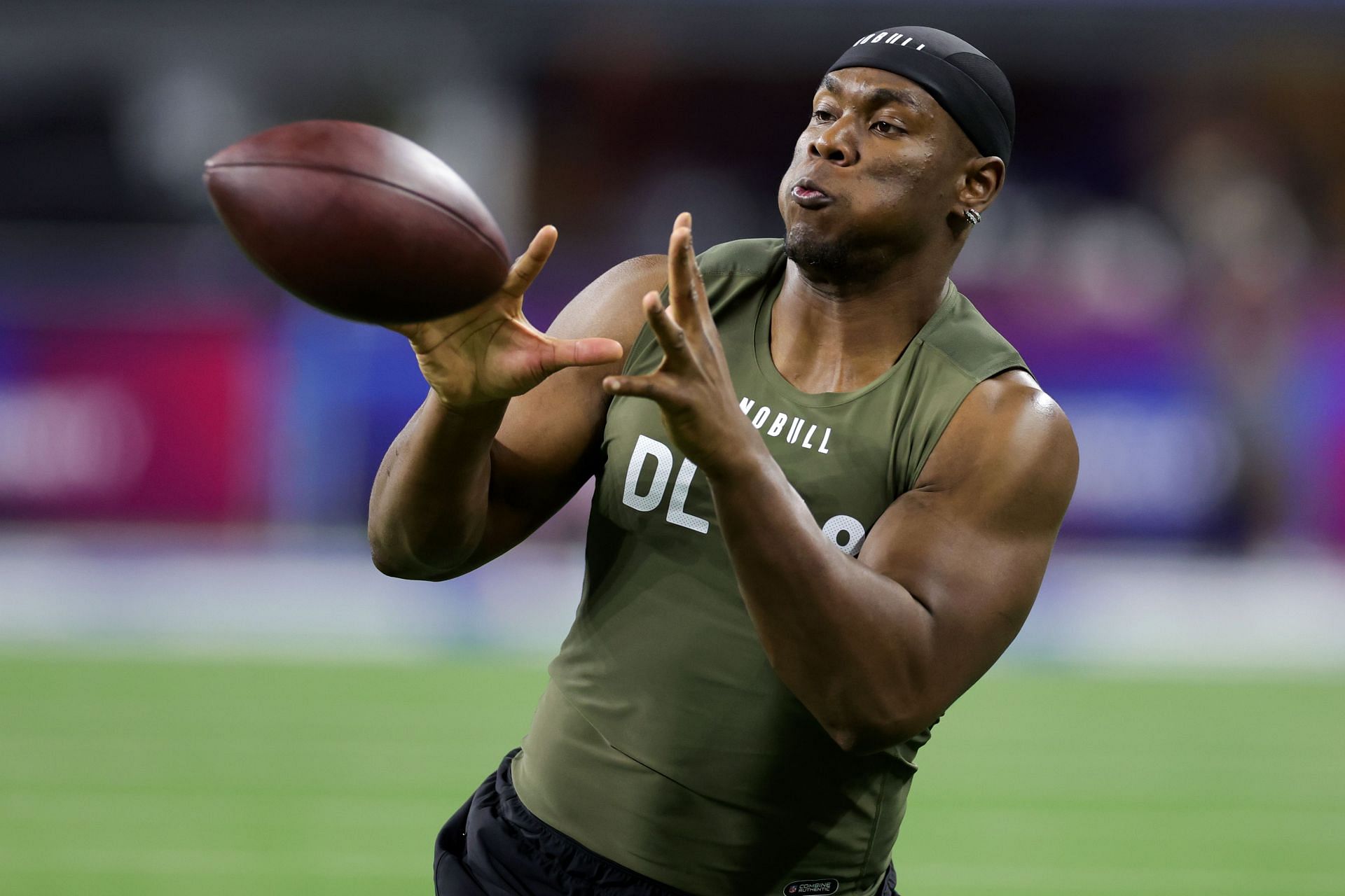 Defensive lineman Keion White of Georgia Tech participates in a drill during the NFL Combine