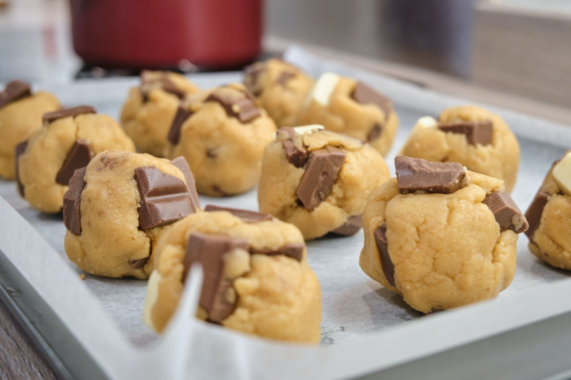 Raw cookie dough must not be consumed without baking. (Image via Unsplash/Ben Stein)