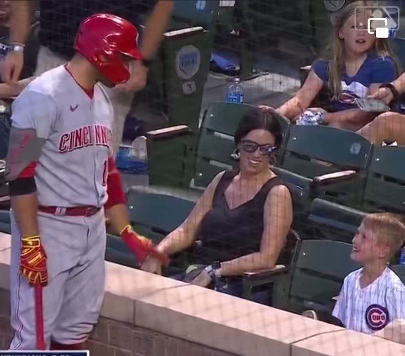 Votto traded his jersey for a Reds fan's shirt