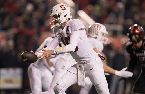 Tanner McKee #18 of the Stanford Cardinal fakes a handoff during the first half of their game against the Utah Utes