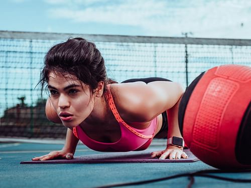 This push-up variation requires you to place your feet aganist a wall. (Photo via Pexels/Lucas Albino)