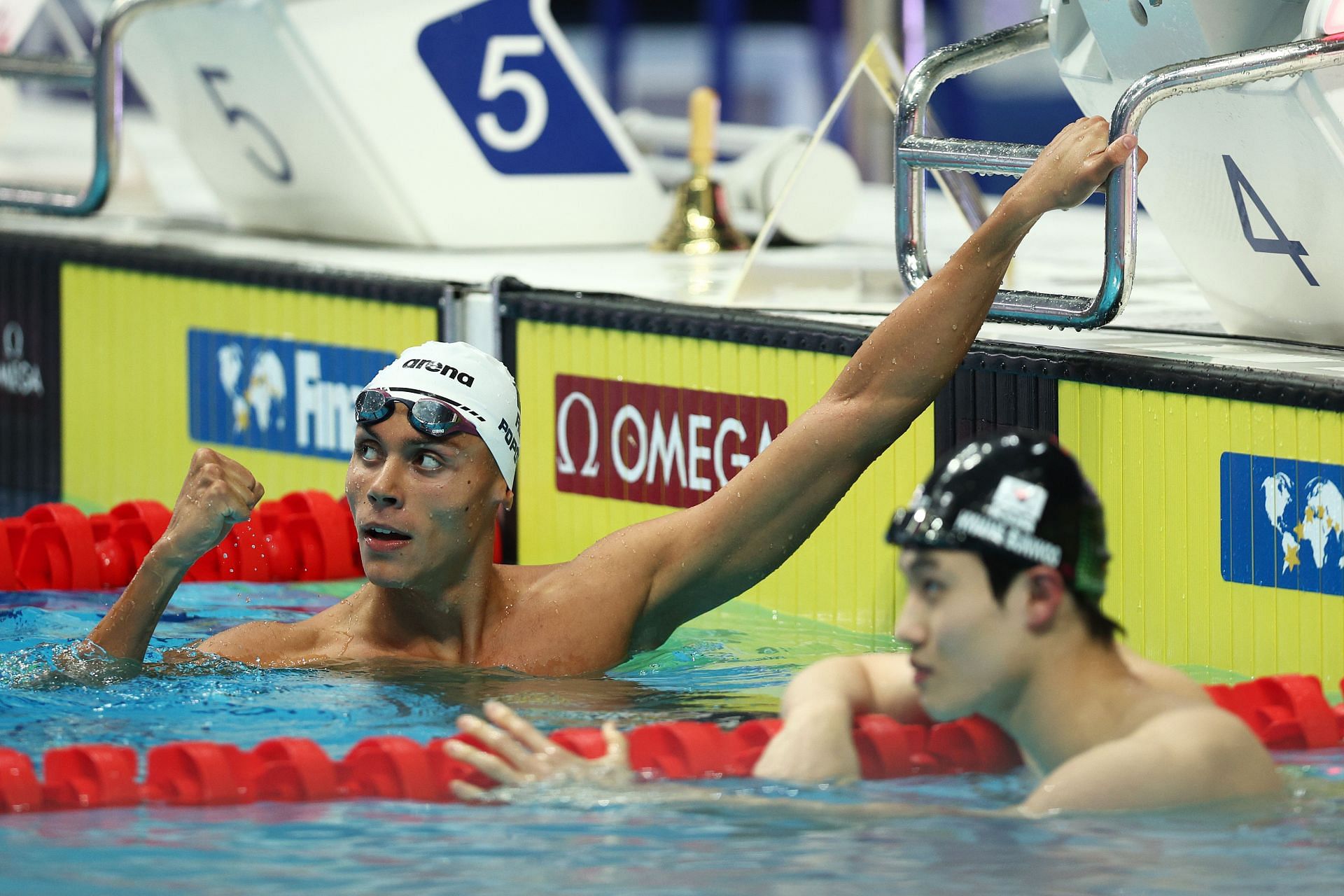 David Popovici of Team Romania celebrates winning gold alongside Silver medallist, Sunwoo Hwang of Team South Korea after the Men&#039;s 200m Freestyle Final on day three of the Budapest 2022 FINA World Championships