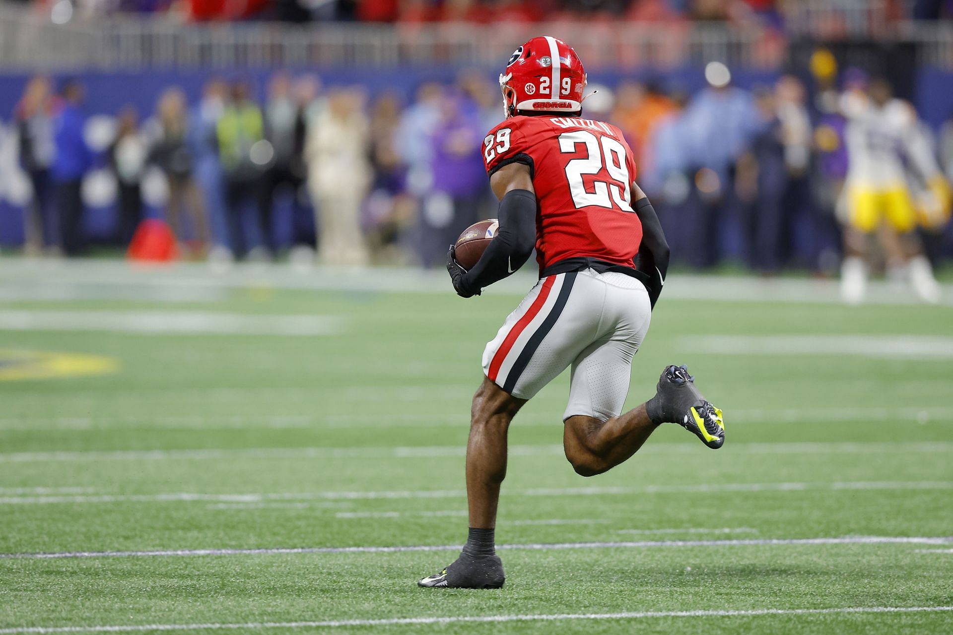 Chris Smith #29 of the Georgia Bulldogs returns a blocked field goal for a 95 yard touchdown against the LSU Tigers