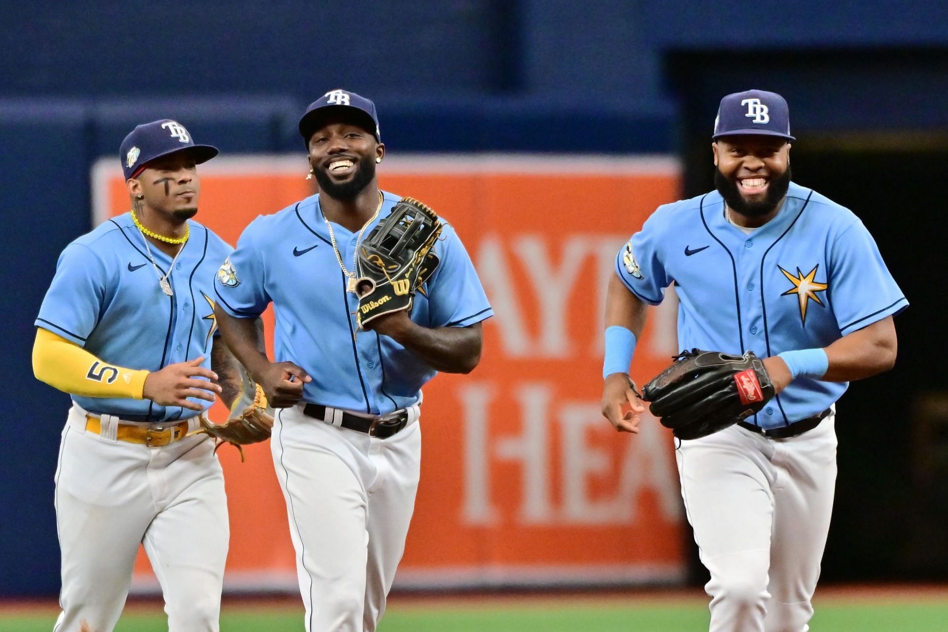 Wander Franco, left, Randy Arozarena, center,, and Manuel Margot of the Tampa Bay Rays run off the field after defeating the Boston Red Sox 9-3 on Thursday.