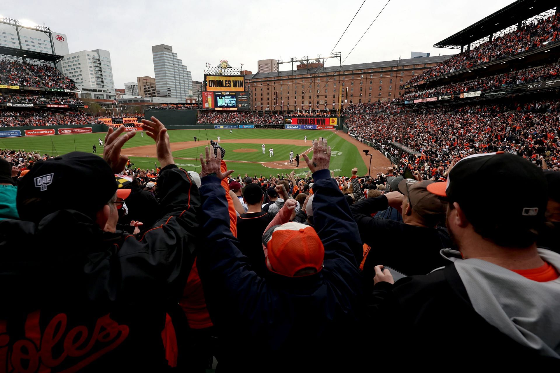 Fans celebrate after Baltimore Orioles defeated the New York Yankees 7-6 during the Orioles home opener