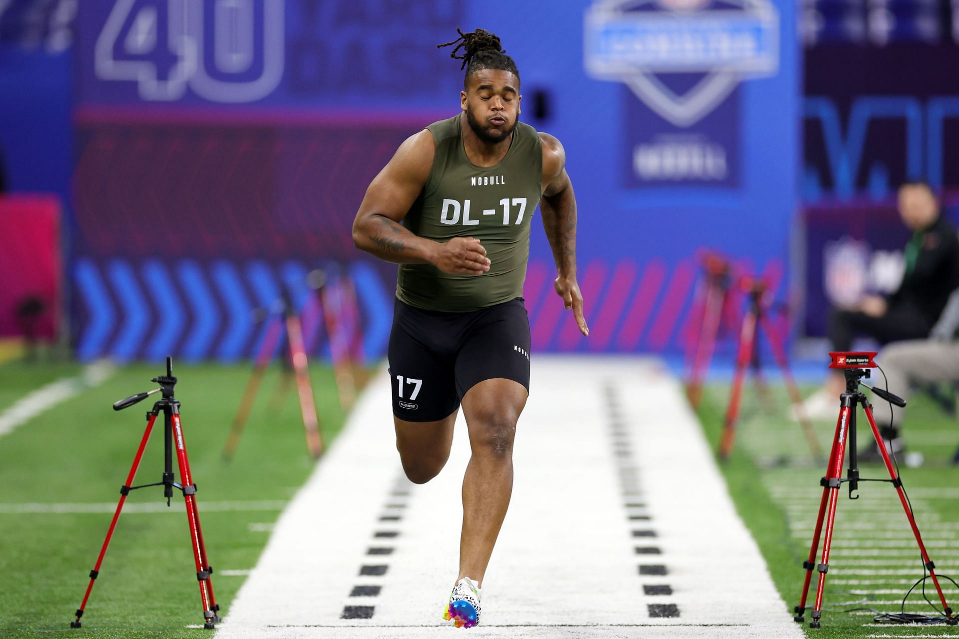 Defensive lineman Dante Stills of West Virginia participates in the 40-yard dash during the NFL Combine