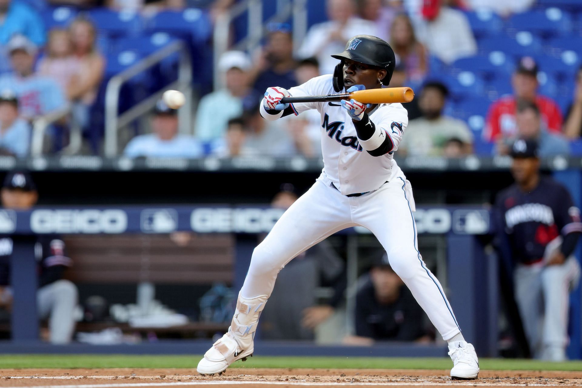 Jazz Chisholm Jr. of the Miami Marlins bunts against the Minnesota Twins.