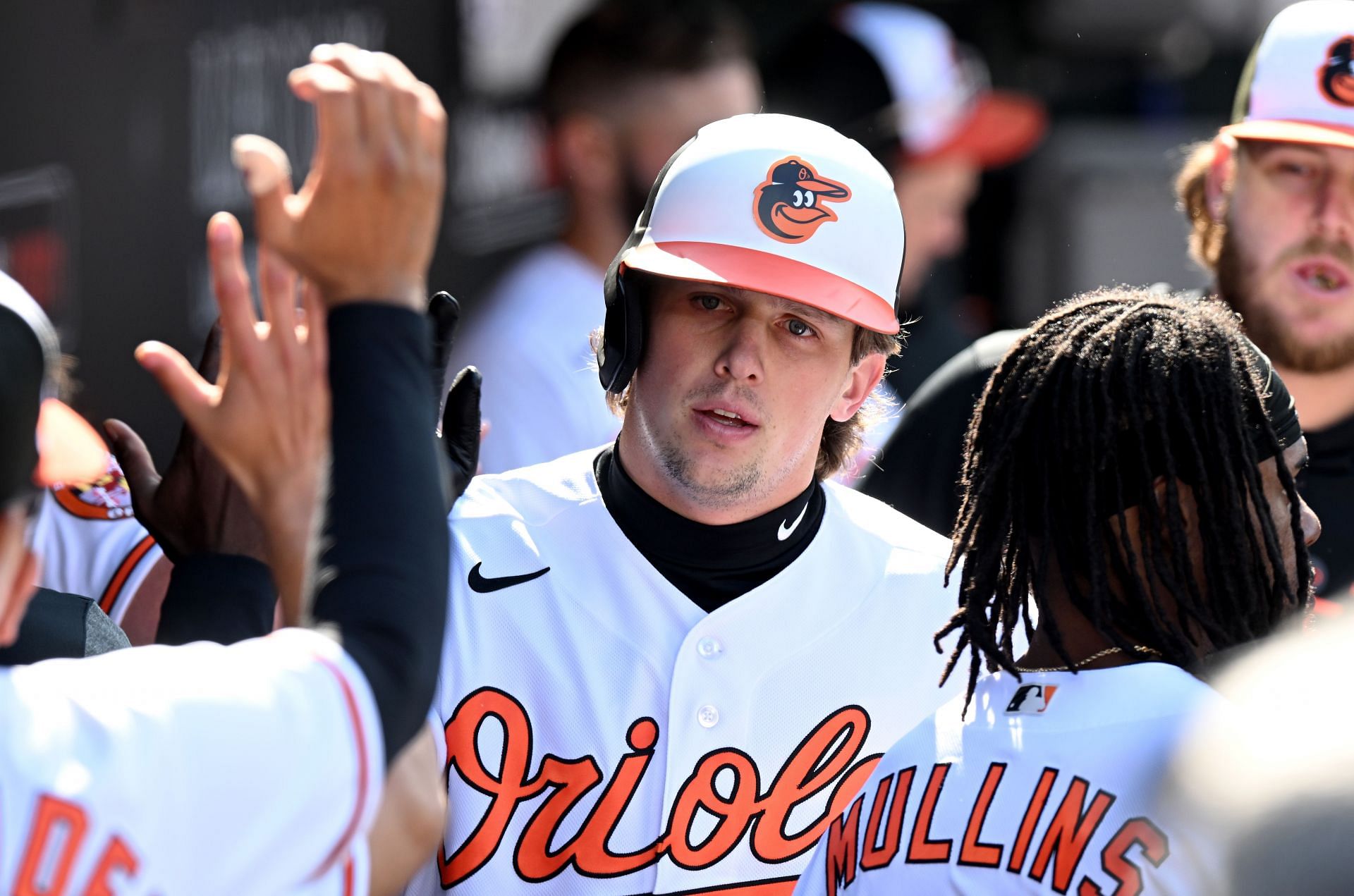Adley Rutschman of the Baltimore Orioles celebrates with teammates after hitting a home run.