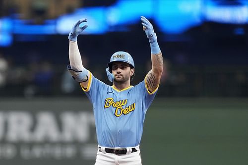 Garrett Mitchell celebrates after hitting a double against the Miami Marlins at American Family Field