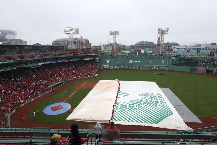 Red Sox fans go shirtless during lengthy rain delay at Fenway