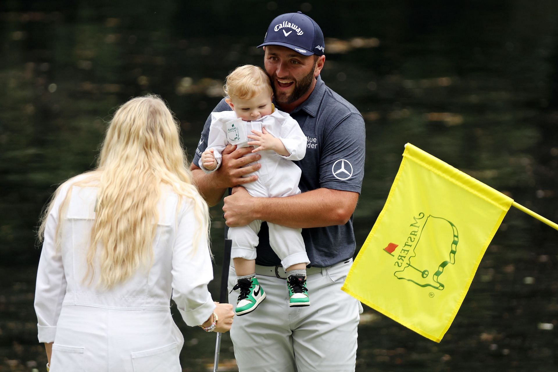 Jon Rahm with his wife and son during 2022 Masters Par-3 contest