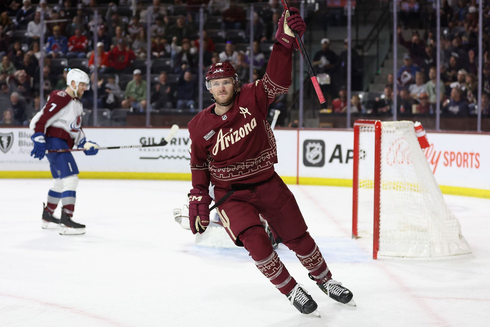 Christian Fischer #36 of the Arizona Coyotes celebrates after scoring a goal