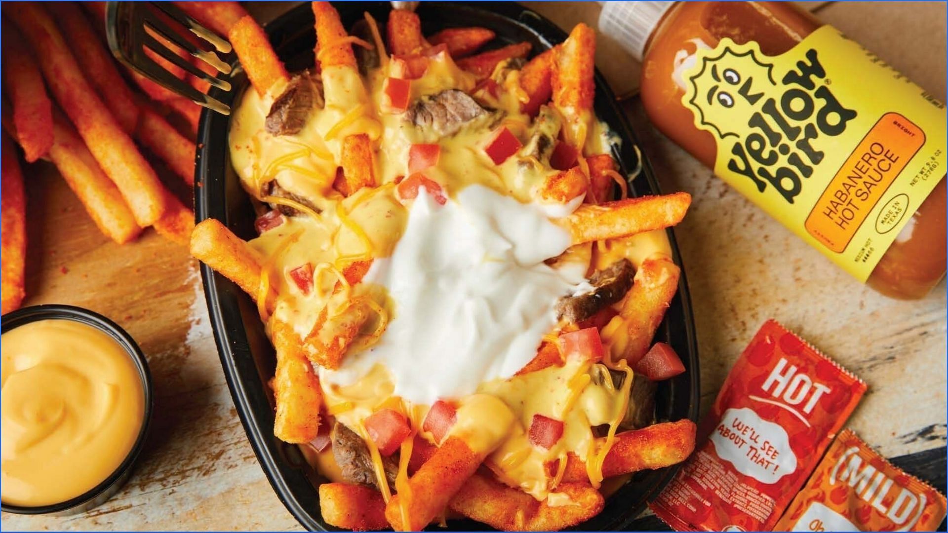 an order for the saucy Yellowbird Nacho Fries can be placed for just $4.99 (Image via Taco Bell)