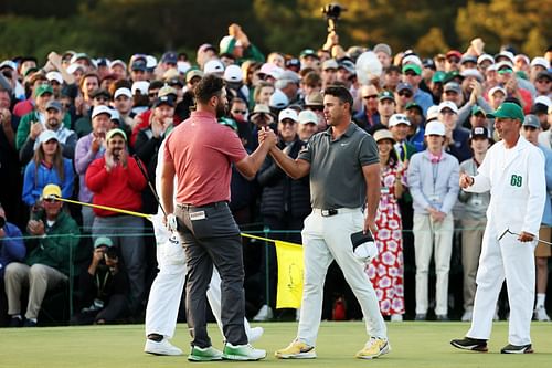 Jon Rahm shakes hands with Brooks Koepka after winning the 2023 Masters