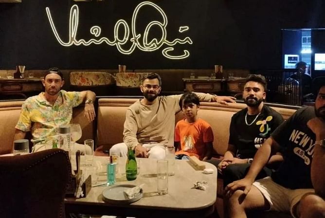 Virat Kohli visits his own One8 restaurant in Kolkata with RCB teammates Faf du Plessis, Mohammed Siraj, and Glenn Maxwell