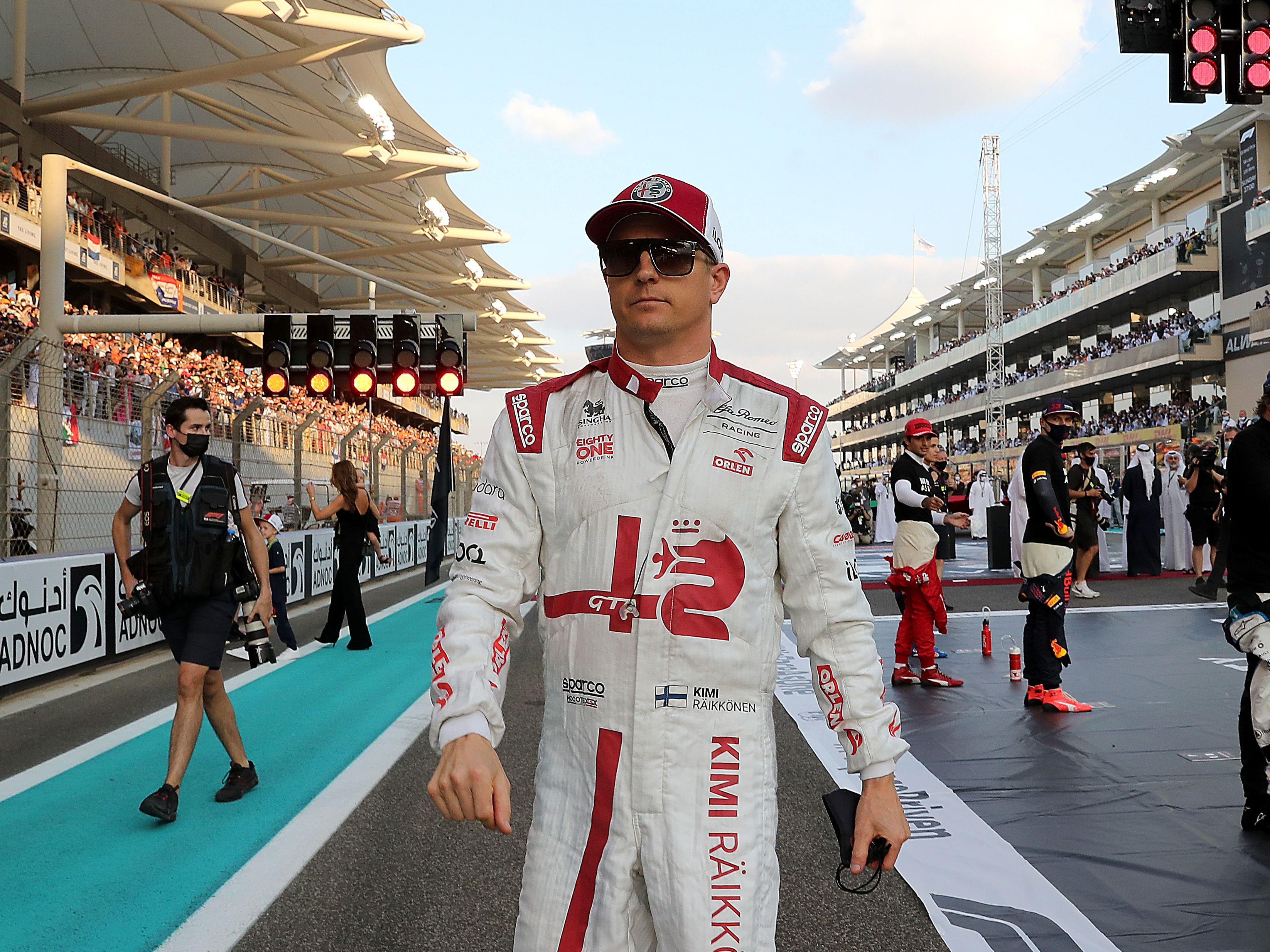 Kimi Raikkonen walks on the grid prior to the 2021 F1 Abu Dhabi Grand Prix (Photo by Kamran Jebreili - Pool/Getty Images)