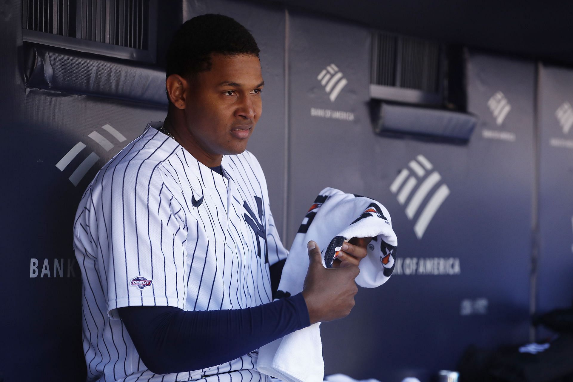 Jhony Brito #76 of the New York Yankees looks on in the dugout during the fourth inning against the San Francisco Giants at Yankee Stadium on April 02, 2023 in the Bronx borough of New York City. This is Brito&#039;s MLB debut.