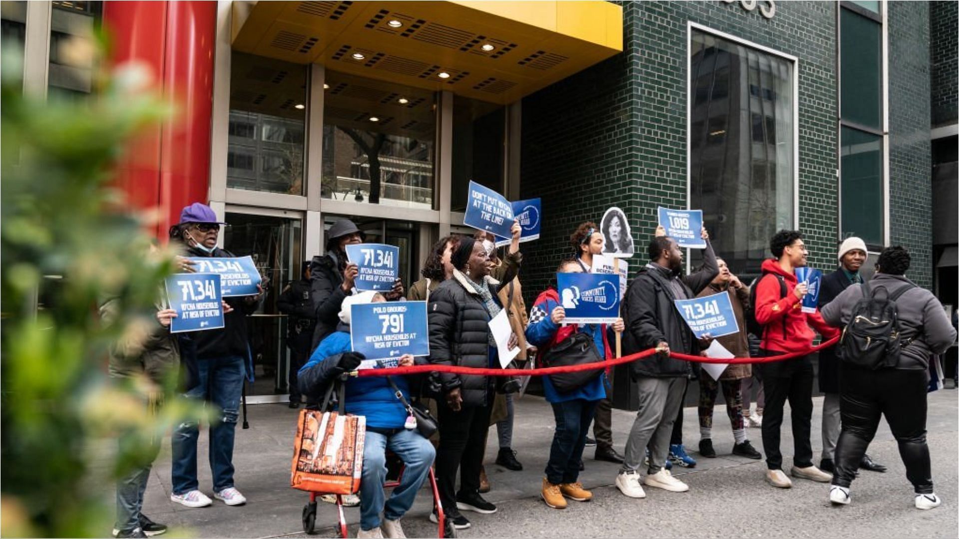 Activists and public housing residents gather and rally for housing and Medicaid relief included into state budget (Image via Lev Redin/Getty Images)