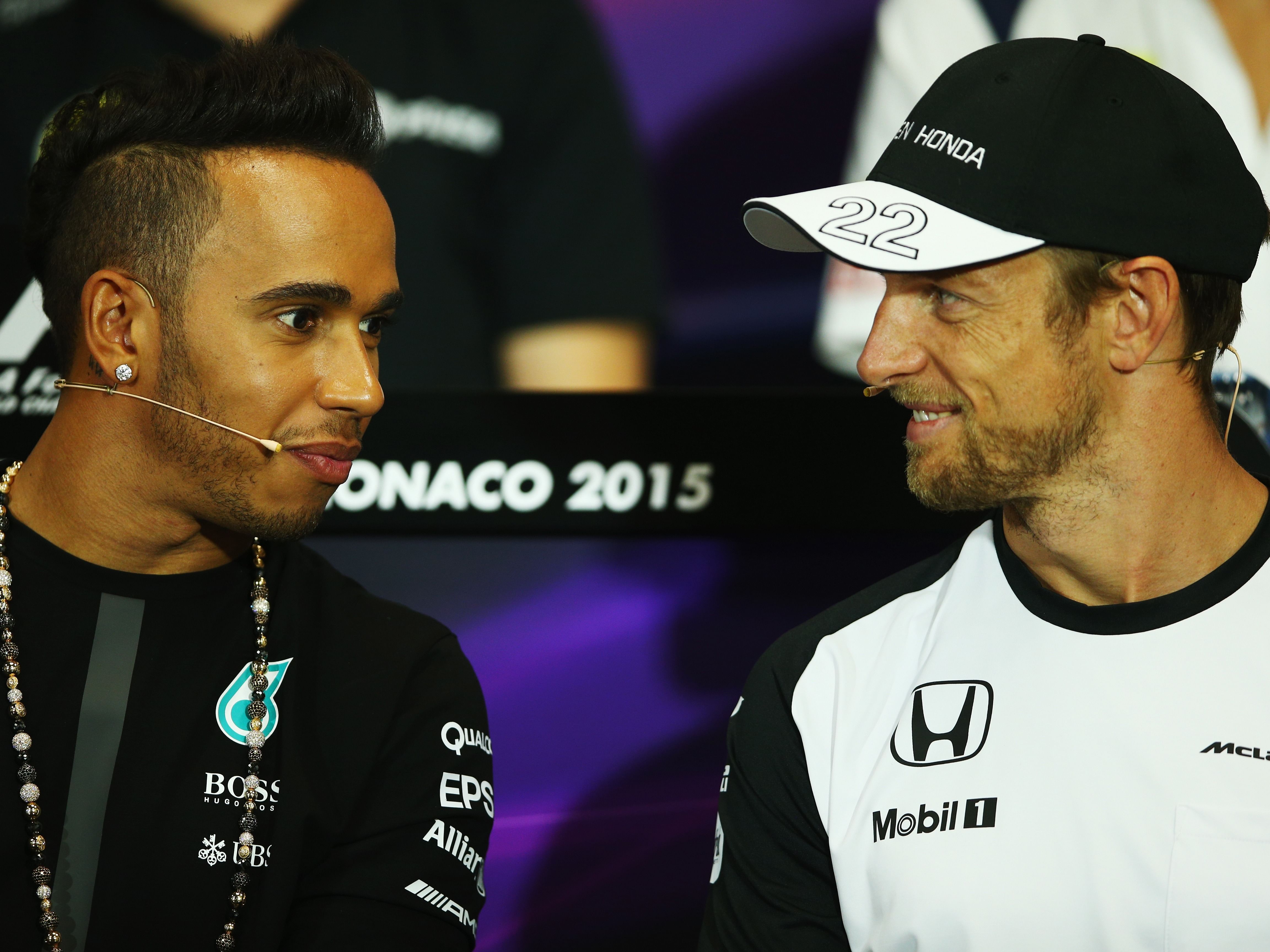 Lewis Hamilton and Jenson Button talking during the drivers press conference during previews to the 2015 F1 Monaco Grand Prix. (Photo by Paul Gilham/Getty Images)