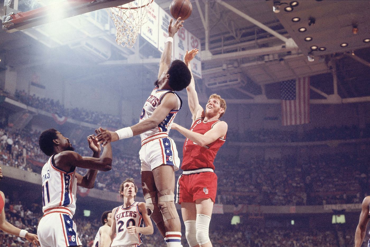 Bill Walton wins his first NBA championship.