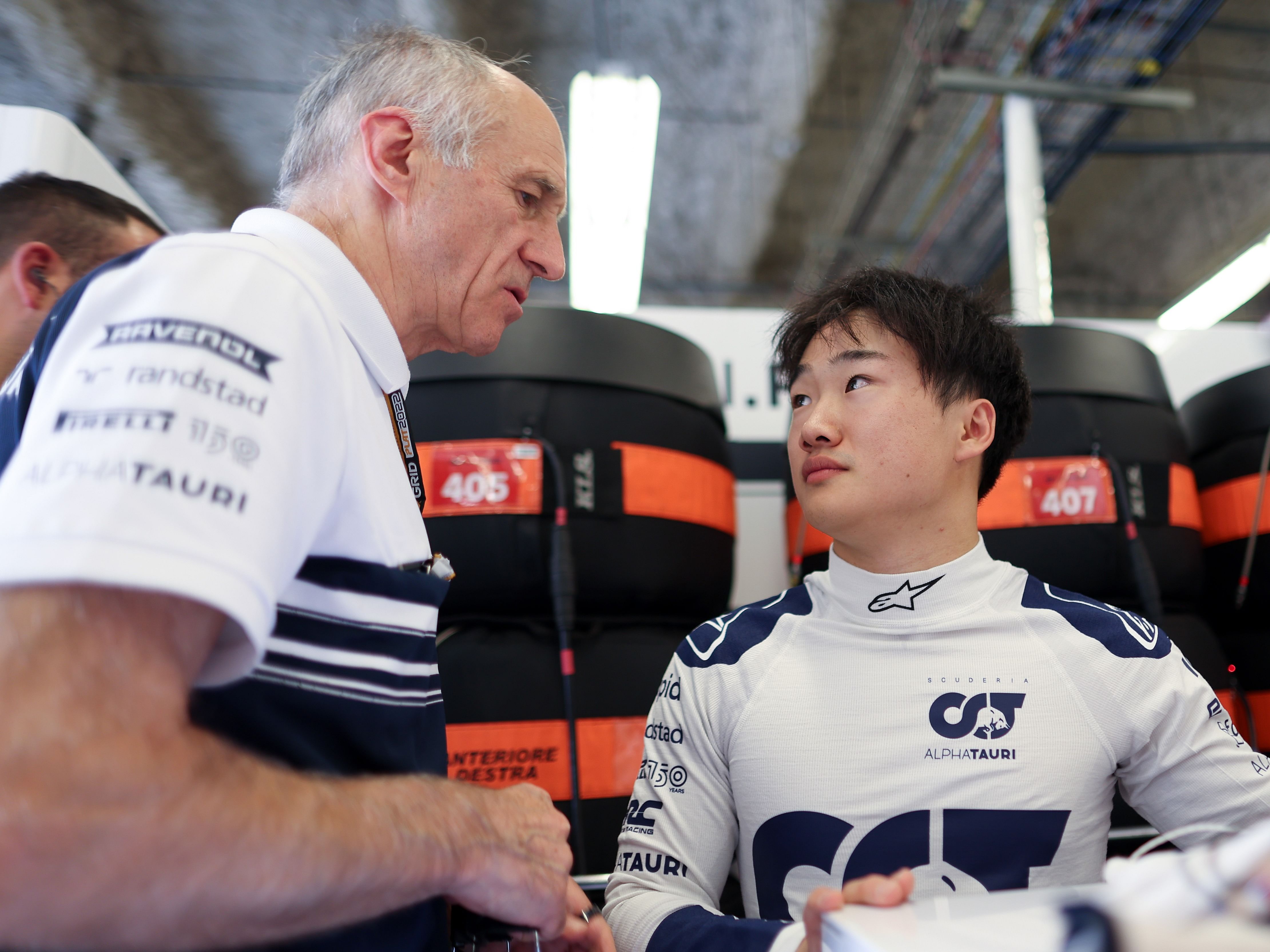 Yuki Tsunoda talks with Franz Tost in the garage during qualifying ahead of the 2022 F1 USA Grand Prix. (Photo by Peter Fox/Getty Images)