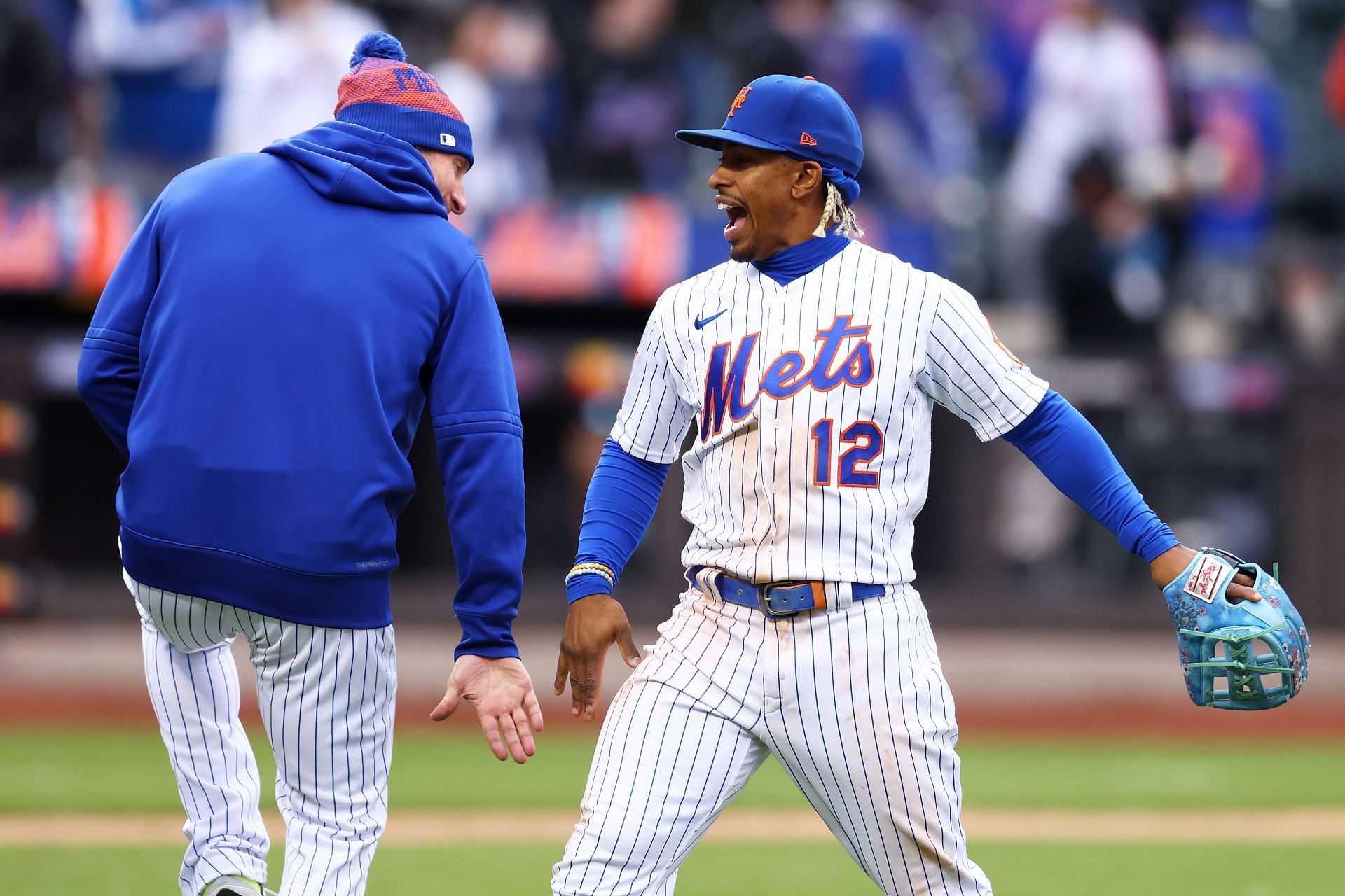 Francisco Lindor #12 and Max Scherzer #21 of the New York Mets celebrate