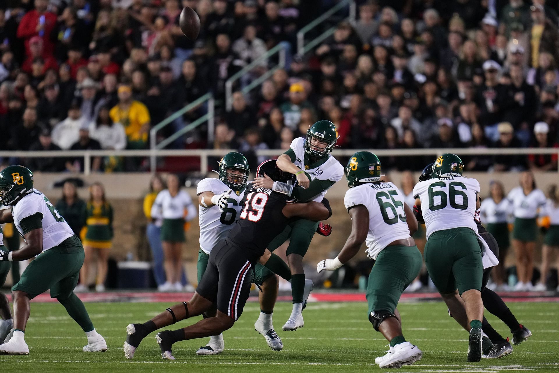 Tyree Wilson #19 of the Texas Tech Red Raiders hits Blake Shapen #12 of the Baylor Bears