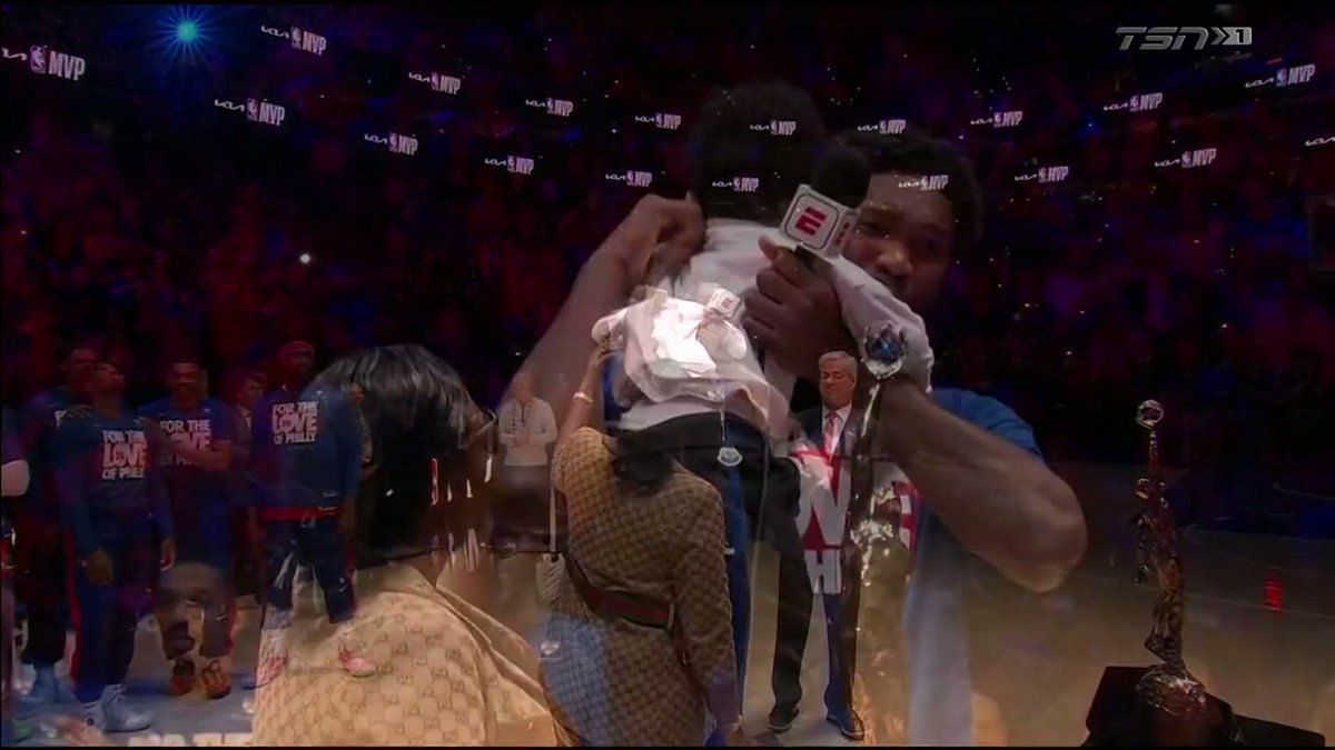 Joel Embiid lifts 2023 NBA MVP trophy with Adam Silver and family 🏆 