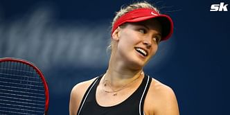 Eugenie Bouchard amused by sculpture at Italian Open player entrance