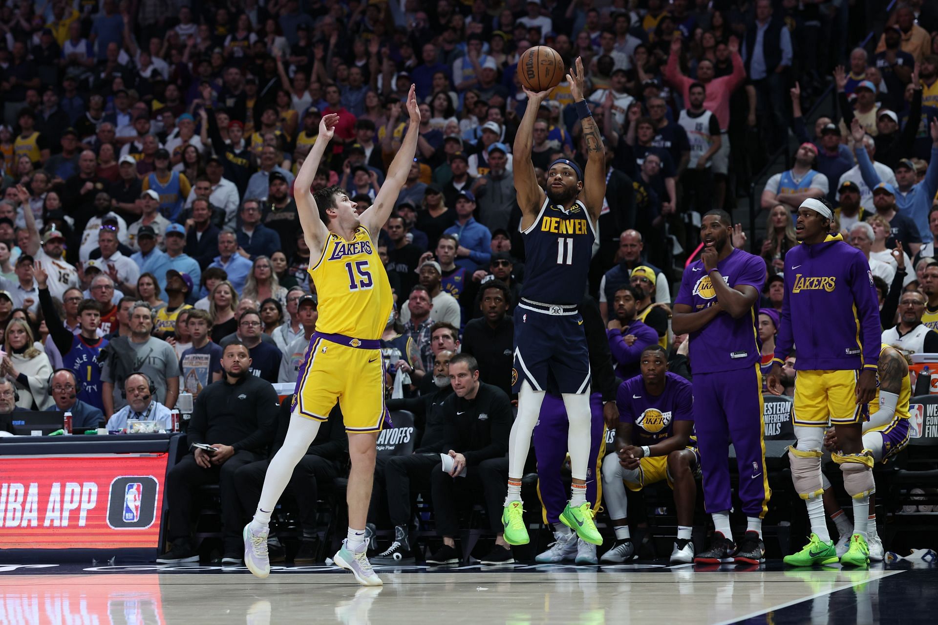 LA Lakers shooting guard Austin Reaves closing out on Denver Nuggets wing Bruce Brown&#039;s 3-point attempt in Game 2 of the Lakers-Nuggets Western Conference finals series