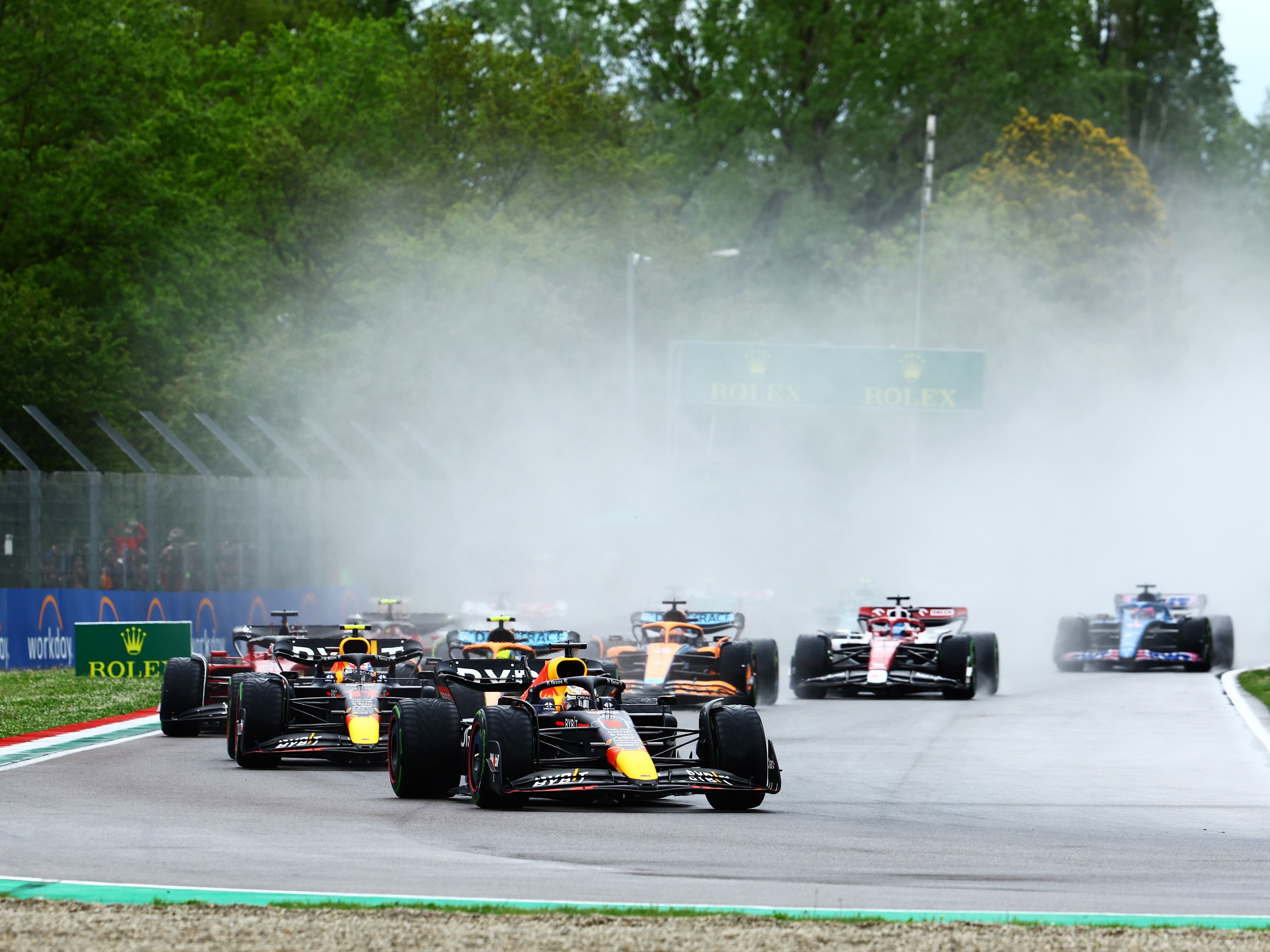Max Verstappen (1) leads Sergio Perez (11) and the rest of the field into turn one at the start during the 2022 F1 Emilia Romagna Grand Prix. (Photo by Mark Thompson/Getty Images)