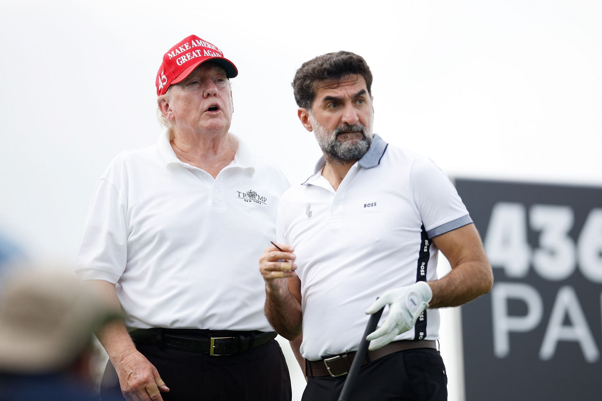 Former U.S. President Donald Trump and Yasir al-Rumayyan, head of the sovereign wealth fund of Saudi Arabia, at the 2022 LIV Golf Invitational (Image via Getty).