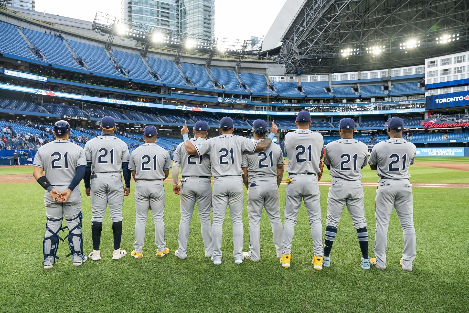 The Tampa Bay Rays pose after playing in the first all-Latino lineup in MLB history, while wearing the number 21 to honor Roberto Clemente day, following their win over the Toronto Blue Jays. (Photo by Mark Blinch/Getty Images)