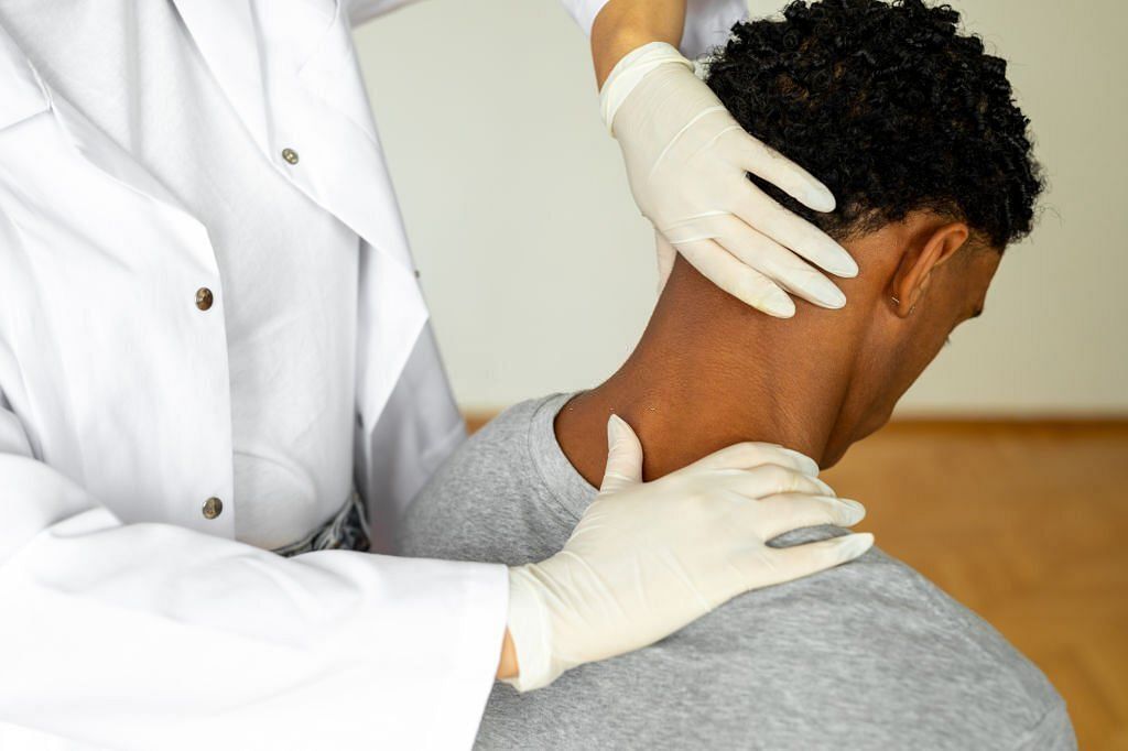 Man having chiropractic neck adjustment