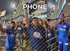 [WATCH] "Arre 𝐑𝐎 bhai, phone toh dete jao"- MI captain Rohit Sharma forgets to return the phone to a fan after taking a photo