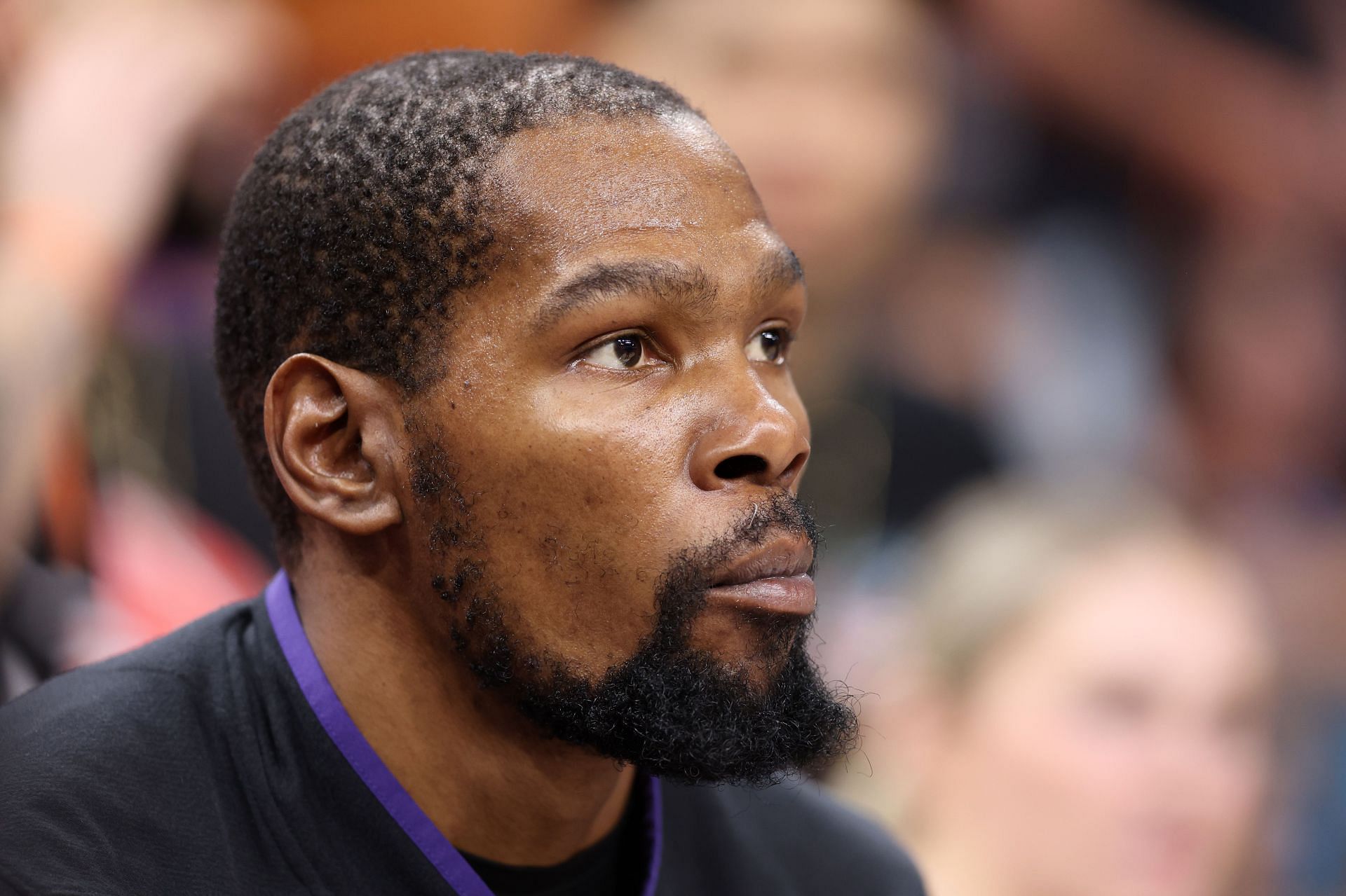 Kevin Durant watches on as the Denver Nuggets play the Phoenix Suns 