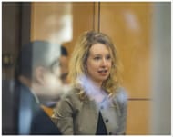 Holmes was charged with wire fraud among other offenses (Image via Getty)