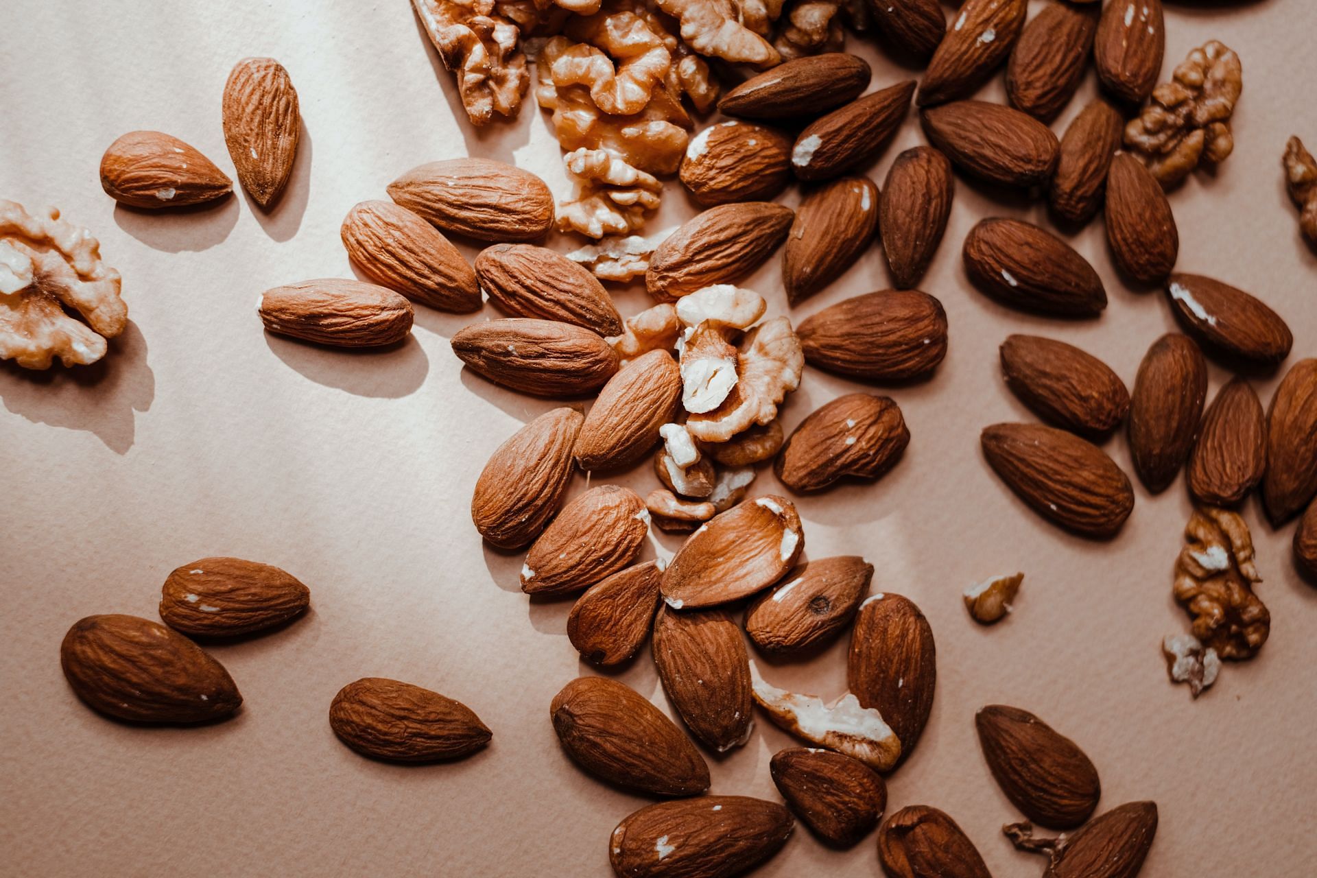 nuts and seeds help in loweing your cholesterol. (image via pexels / vie studio)