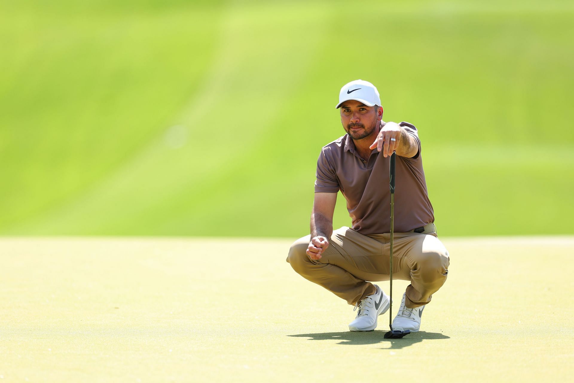 Jason Day lines up his put on the 13th green at Wells Fargo Championship - Round Two