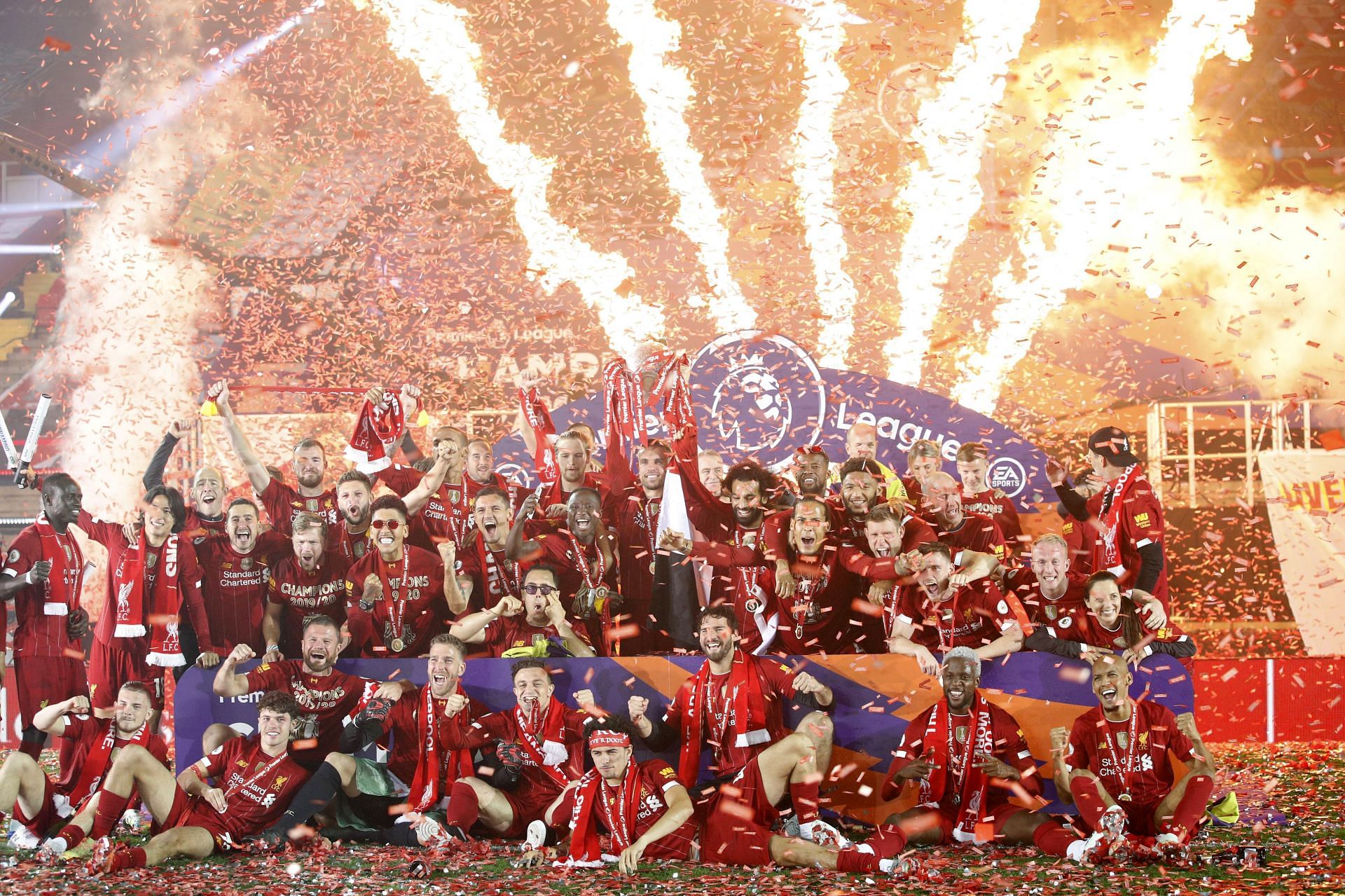 Jordan Henderson of Liverpool lifts The Premier League trophy