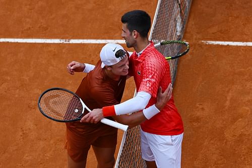 Novak Djokovic(right) congratulates Holger Rune(left) after their quarterfinal match at 2023 Italian Open