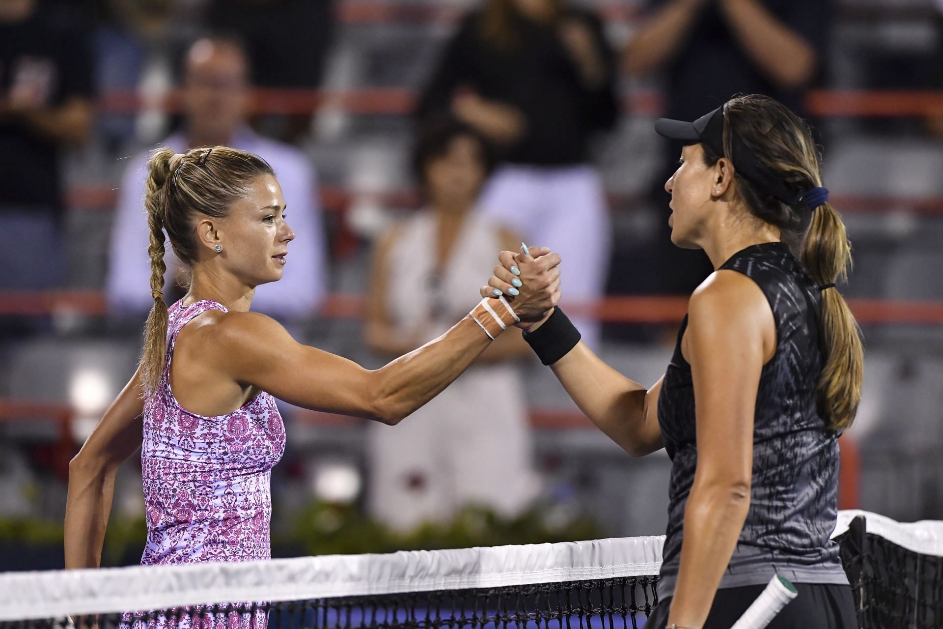 Camila Giorgi (L) and Jessica Pegula